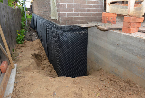 SJ Waterproofing Pros technician performing targeted Waterproofing assessment in Lakeside, OR